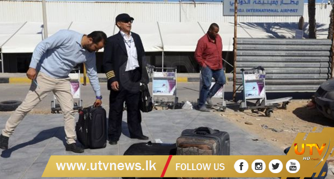 Libya crisis: Air strike at Tripoli airport as thousands flee clashes